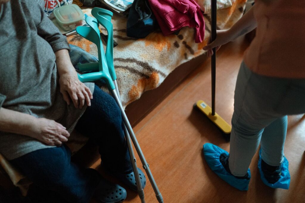 A support worker helping with household chores at home